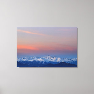 Lienzo Montañas nevadas con un cielo mágico