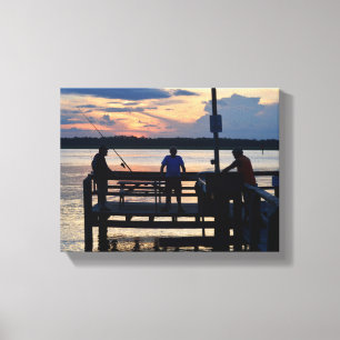 Lienzo Personas en un muelle pescando al atardecer