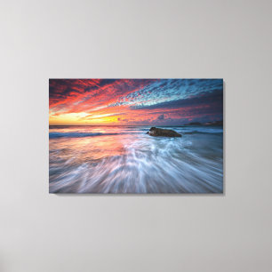 Lienzo Playa de piedra espectacular de la puesta del sol