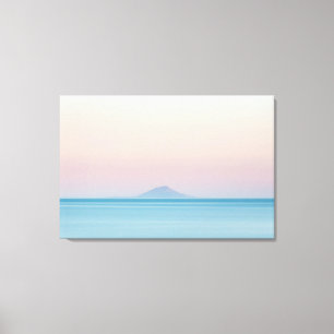 Lienzo Silueta de la isla en el horizonte al atardecer