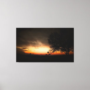 Lienzo Silueta de un árbol al atardecer