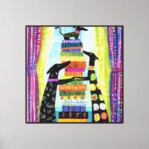 Lienzo Torre de libros equilibrada por perros negros
