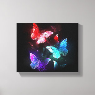Lienzo Tres mariposas brillantes en el fondo nocturno
