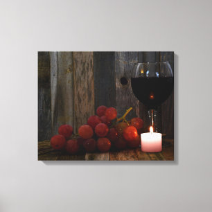 Lienzo vino y uvas a la luz de una vela