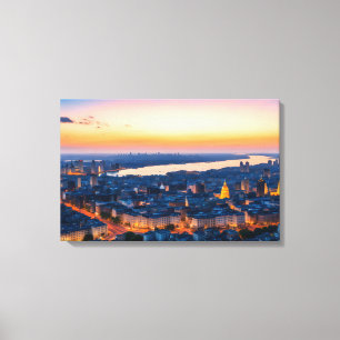 Lienzo Vista panorámica de la ciudad al atardecer