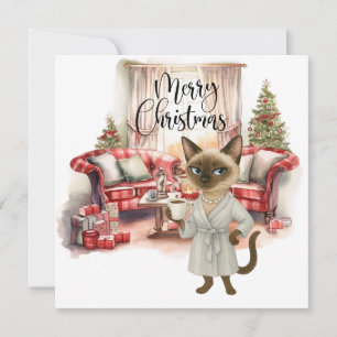 Limpieza de Navidad del gato siamés en la casa