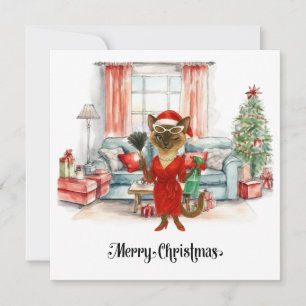 Limpieza de Navidad del gato siamés en la casa