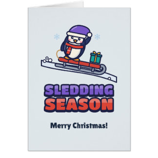 Lindo pingüino en un trineo rojo Navidad para niño
