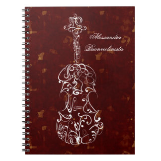 Línea blanca violín en el cuaderno espiral rojo