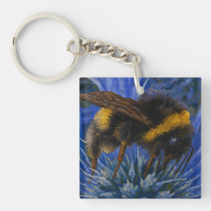 Llavero Abeja de púas sobre el cardo azul