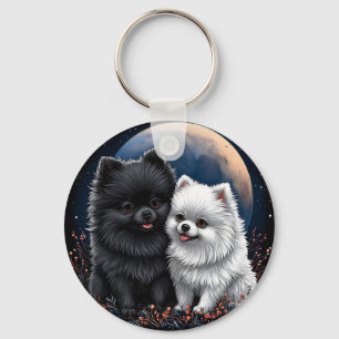 Llavero Adorables cachorros de Pomerania negros y blancos