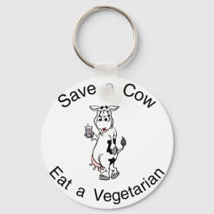 Llavero Ahorre una vaca comen a un vegetariano