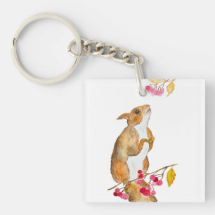 Llavero Ardilla acuática divertida en una rama con bayas