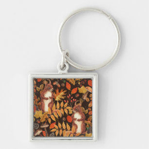 Llavero ardillas y flora otoñales en marrón oscuro