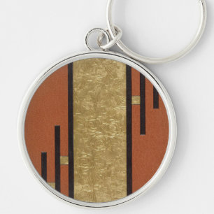 Llavero Art Deco en dorado y beige