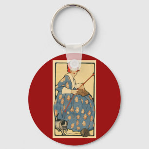 Llavero Arte Nouveau - chica que hace punto con su gato