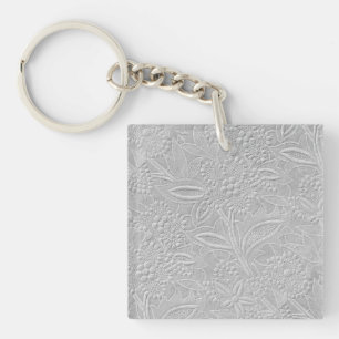 Llavero Aspecto floral gris embossado