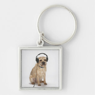 Llavero Auriculares que llevan del pequeño perro