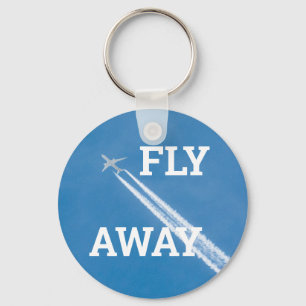 Llavero Avión vuela en el cielo azul