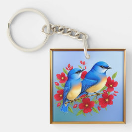 Llavero Azules pájaros coloridos posados entre flores roja