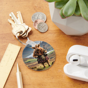 Llavero Bagpiper de vaca de la región montañosa de Escocia