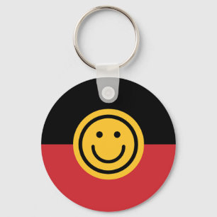 Llavero Bandera aborigen australiana con cara de sonrisa