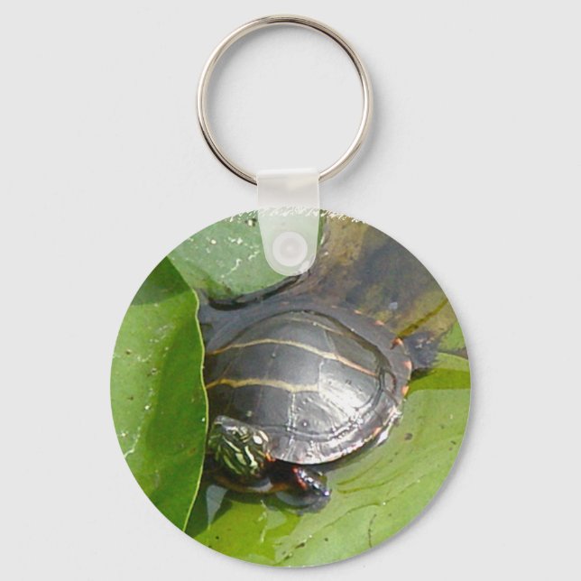 Llavero Bebé con tortuga pintada en ílipos (Anverso)