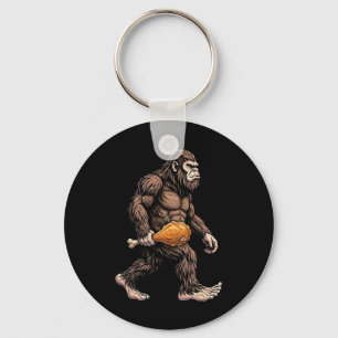 Llavero Bigfoot llevando muslo de pollo amante de Sasquatc