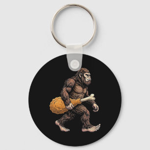 Llavero Bigfoot llevando muslo de pollo amante de Sasquatc
