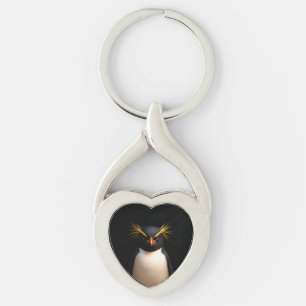 Llavero Black 4 Luxe con pingüino de penacho rojo