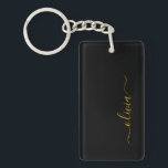 Llavero Black Gold Modern Script Girly Monograma Nombre<br><div class="desc">Cadena de claves de nombres de monograma de escritura simple en negro y dorado. Esto hace que el dulce perfecto cumpleaños 16,  boda,  ducha de novia,  aniversario,  ducha de bebé o fiesta de soltera sea regalo para alguien que ama el lujo glam y los estilos de moda.</div>