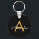 Llavero Black Gold Modern Script Girly Monograma Nombre<br><div class="desc">Cadena de claves de nombres de monograma simple de guiones negros y dorados (cadena de claves). Esto hace que el dulce perfecto cumpleaños 16,  boda,  ducha de novia,  aniversario,  ducha de bebé o fiesta de soltera sea regalo para alguien que ama el lujo glam y los estilos de moda.</div>