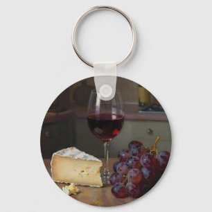 Llavero Bodegón realista de queso y uvas con vino tinto