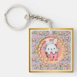 Llavero Bonito conejo de Pascua sentado en la canasta
