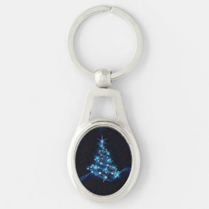 Llavero Brillo azul de estrellas en árbol de Navidad oscur