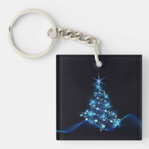 Llavero Brillo azul de estrellas en árbol de Navidad oscur