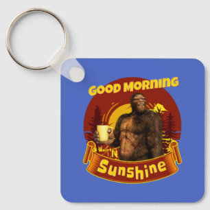 Llavero Buenos Días Sol Bigfoot Café Humor Arte