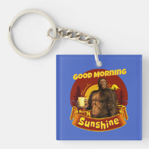 Llavero Buenos Días Sol Bigfoot Café Humor Arte