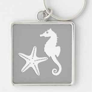 Llavero caballito de mar y pez estrella - blanco sobre gri