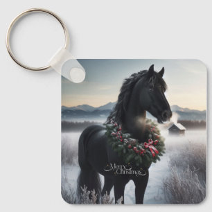Llavero Caballo negro en la nieve con corona de Navidades