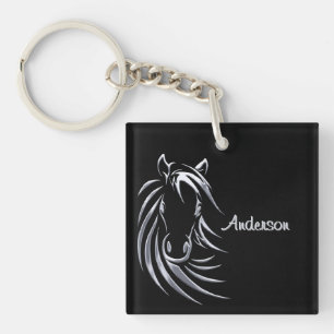 Llavero Cabeza de caballo plateado con guión negro persona