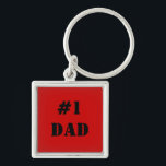 Llavero Cadena de claves de #1 papá<br><div class="desc">¡Celebremos la grandeza de tu padre con nuestra cadena de claves Metalizado cuadradas de primer nivel "#1 DAD"! Esta cadena de claves elegante y duradera está diseñada para recordarle lo especial que es cada vez que agarra sus llaves. Esta cadena de llaves, elaborada a partir de un metalizado de alta...</div>