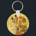 Llavero Cadena de claves de cumplimiento Gustav Klimt<br><div class="desc">Cadena de claves Gustav Klimt Fulfillment. Friso de 1909. Completada durante la fase dorada de Klimt, el Fulfillment presenta una pareja abrazadora que se sostiene bajo un tejido con múltiples patrones, con espirales, ojos, aves, peces y otras formas. El fondo de la obra incluye las mismas espirales de bronce que...</div>