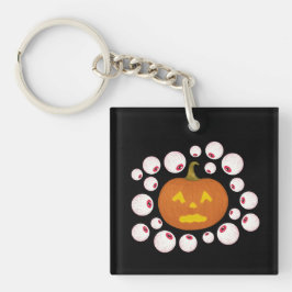 Llavero Calabaza Jack-o-Lantern y los ojos amarillos en la