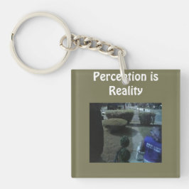Llavero Camiseta "La Percepción es la Realidad"