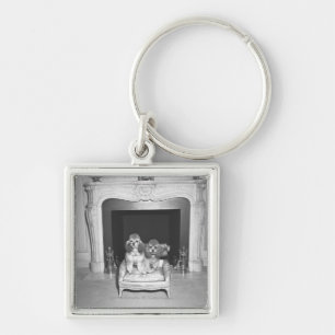 Llavero Caniches miniatura que se sientan delante de la