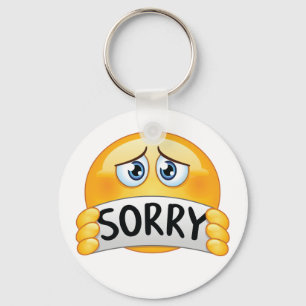Llavero Cara de Emoji Triste con Letrero de Disculpa