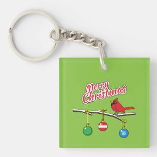 Llavero Cardenal Rojo sobre la rama desnuda de los Navidad