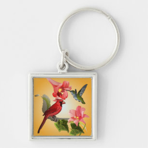 Llavero Cardenal y colibrí con los lirios y la hiedra