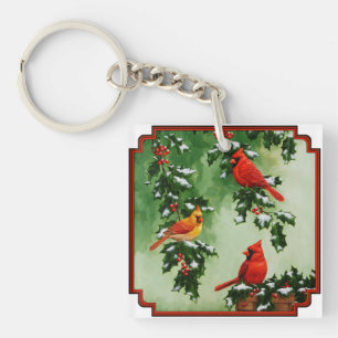 Llavero Cardenales rojos del norte y acebo